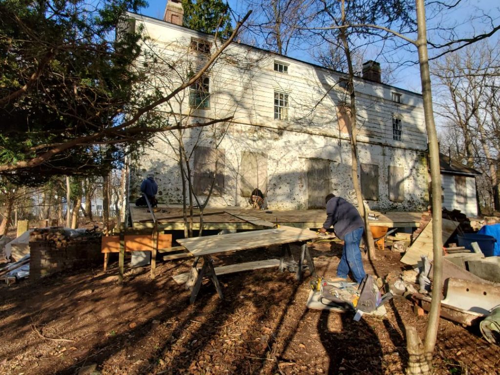 Fifty Three Restoration staff conducting stabilization work on the Olmsted-Beil House, January 2020.